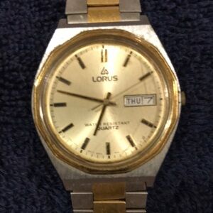 Lorus Vintage Men’s watch. Gold face with calendar. Stainless steel back.